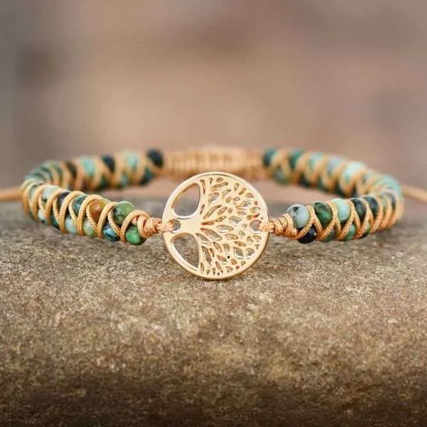 Pulsera de jaspe africano hecha a mano con el símbolo del Árbol de la Vida. El Árbol de la vida representa la esencia de nuestra propia existencia y transmite una gran fuerza y positivismo.