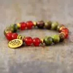 Pulsera espiritual con piedras de cornalina, unakita, jaspe y flor de loto