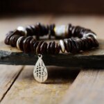 Pulsera zen con dije budista y piedras medicinales de broncita