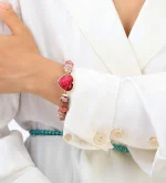 Pulsera de armonía emocional con rodonita, corazón de jade y dije OM
